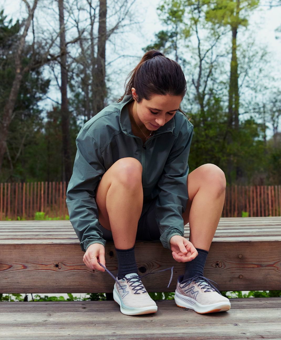 Female runner with her women's specific running shoe