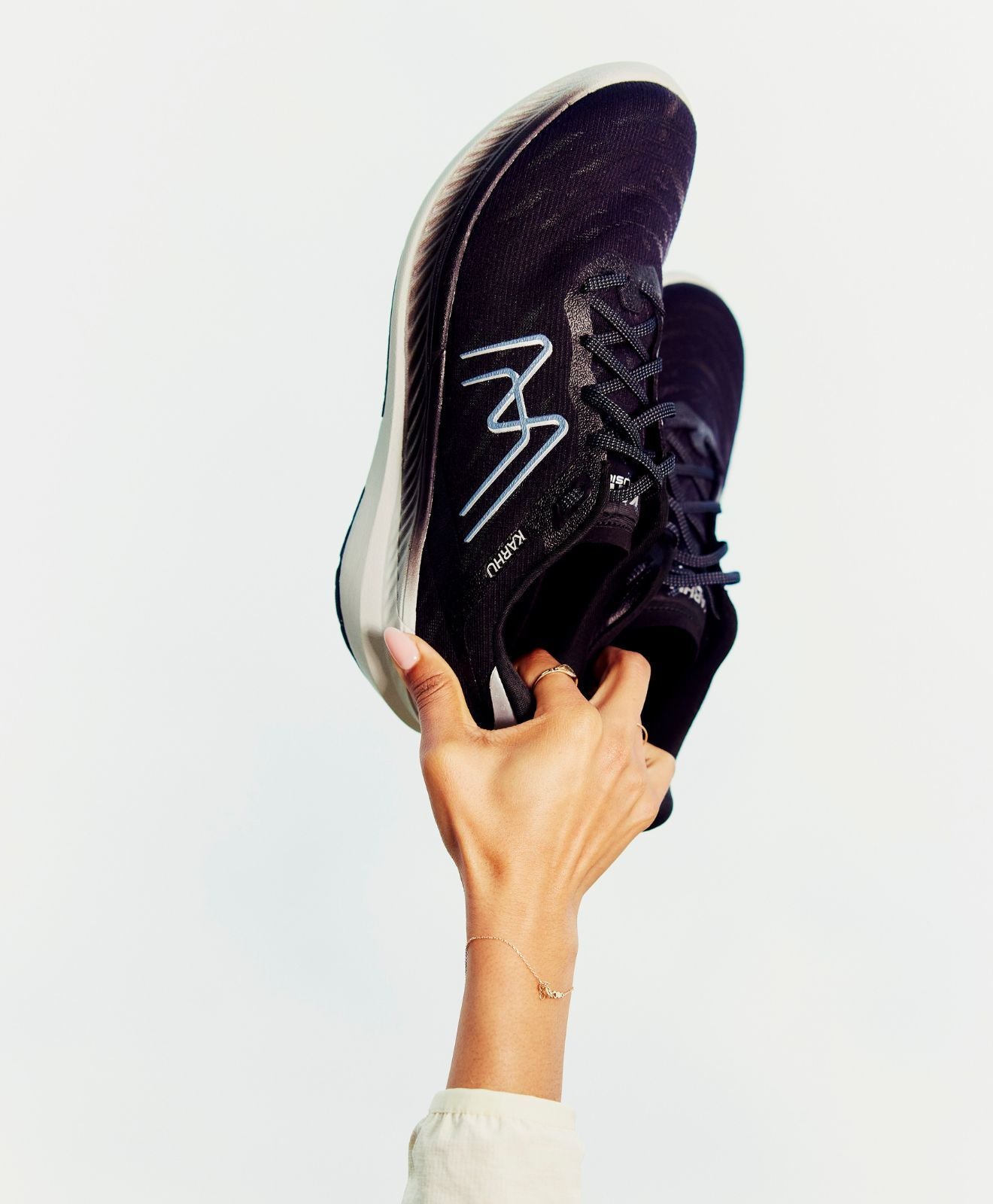 women's karhu fusion black wide fit holding up the air